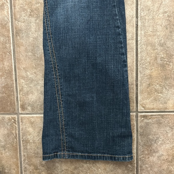 Dark mid rise boot cut jeans with asymmetrical outside hem size 8 - Picture 3 of 5